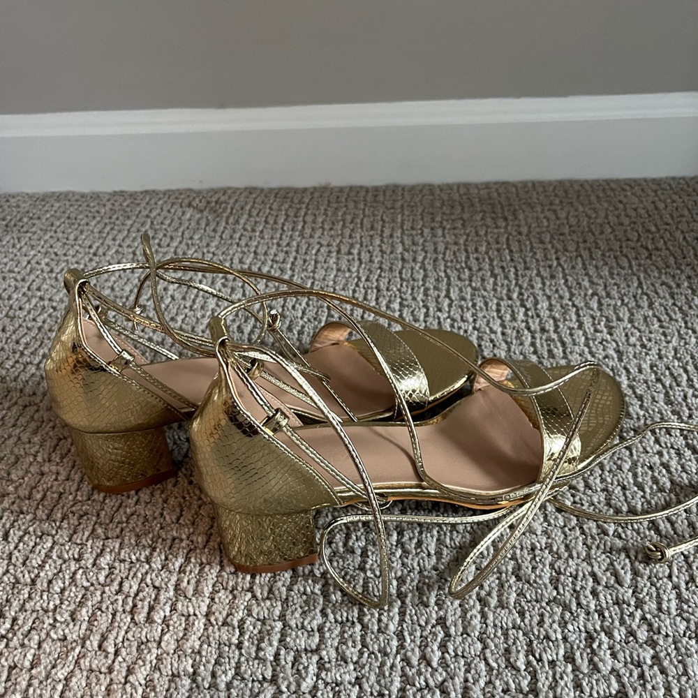 Absolutely stuffing lace up gold sandals